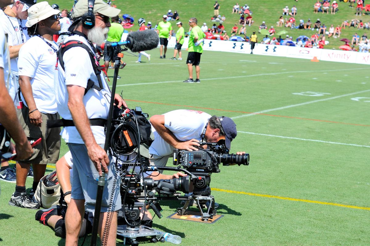 Hard Knocks crew filming the Falcons' practice.