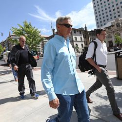 Libertarian presidential candidate Gov. Gary Johnson walks toward City Creek Center as he and running mate Gov. Bill Weld look for lunch in Salt Lake City prior to giving a speech at the University of Utah on Saturday, Aug. 6, 2016.