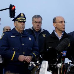 Officials address the media during a news conference in Watertown, Mass., Friday, April 19, 2013. Officials are urging residents of Watertown and surrounding towns to stay indoors. One of two suspects in the Boston Marathon bombing is dead after the killing of a university officer and a shootout with police, and a massive manhunt is underway for the other, authorities said early Friday. (AP Photo/Julio Cortez)