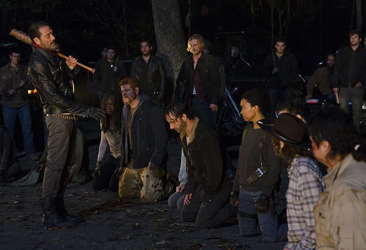 Negan (Jeffrey Dean Morgan) stands in front of the Walking Dead crew with a baseball bat