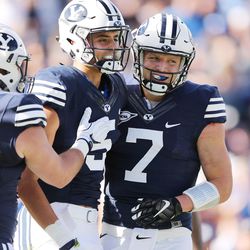 Brigham Young Cougars quarterback Taysom Hill (7) and Brigham Young Cougars wide receiver Nick Kurtz (5) celebrate their touchdown against the Southern Utah Thunderbirds  in Provo on Saturday, Nov. 12, 2016.