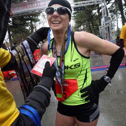 Becky Sondag gets her medal after winning the women's Salt Lake City Marathon in Salt Lake City on Saturday, April 20, 2013.