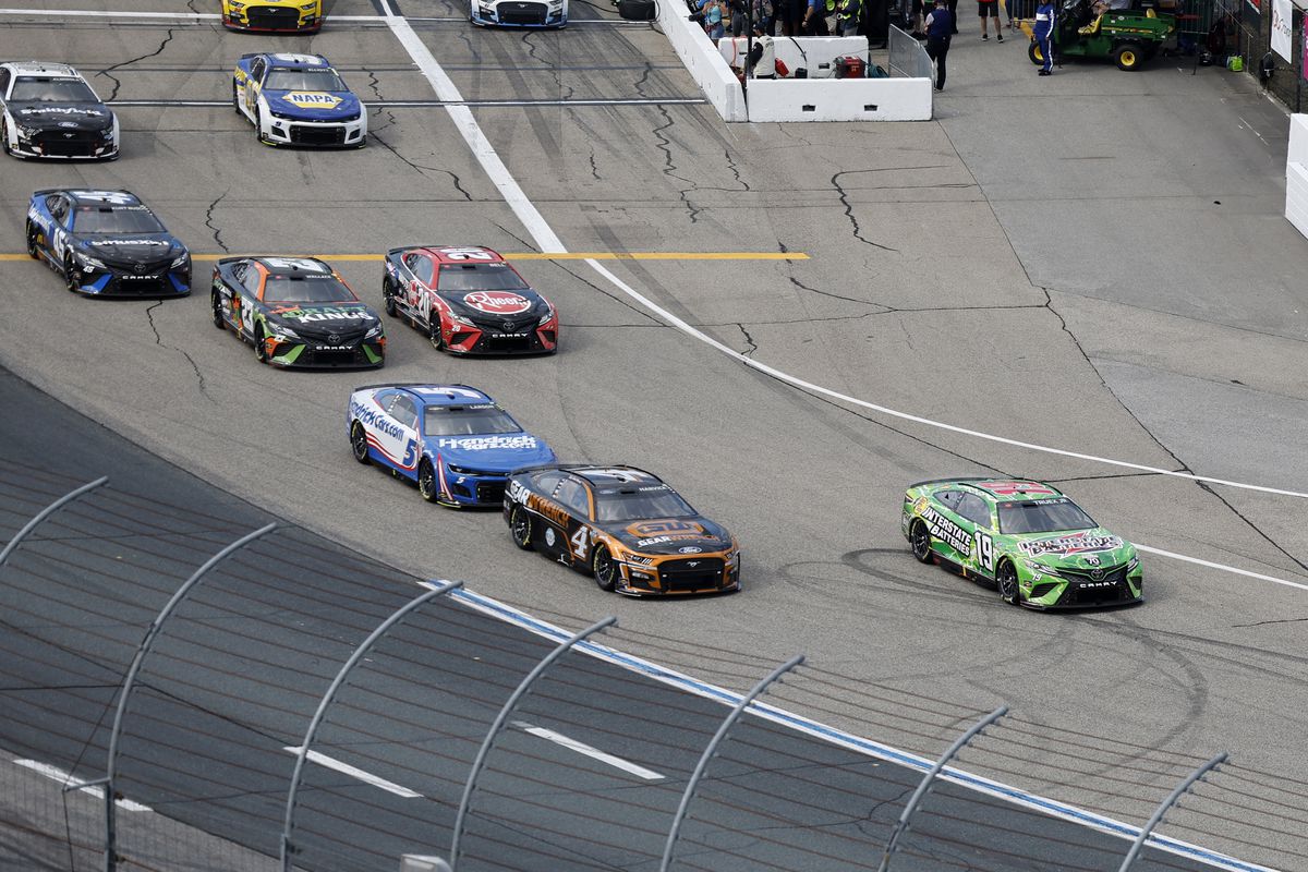 Cars jockey for position leaving Pit Road uring the NASCAR Cup Series Ambetter 301 on July 17, 2022, at New Hampshire Motor Speedway in Loudon. New Hampshire.