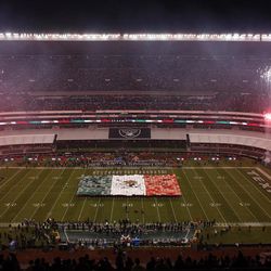 Fireworks explode during the playing of the Mexican national anthem before an NFL football game between the Oakland Raiders and the Houston Texans Monday, Nov. 21, 2016, in Mexico City. 
