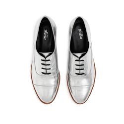 Leather oxfords in silver, $185