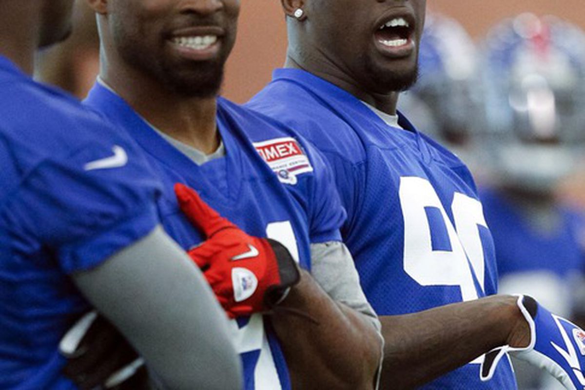 Jun 14, 2012; East Rutherford, NJ, USA;   New York Giants defensive end Justin Tuck (left) and defensive end Jason Pierre-Paul (right) during the Giants minicamp at their training facility. Mandatory Credit: Jim O'Connor-US PRESSWIRE