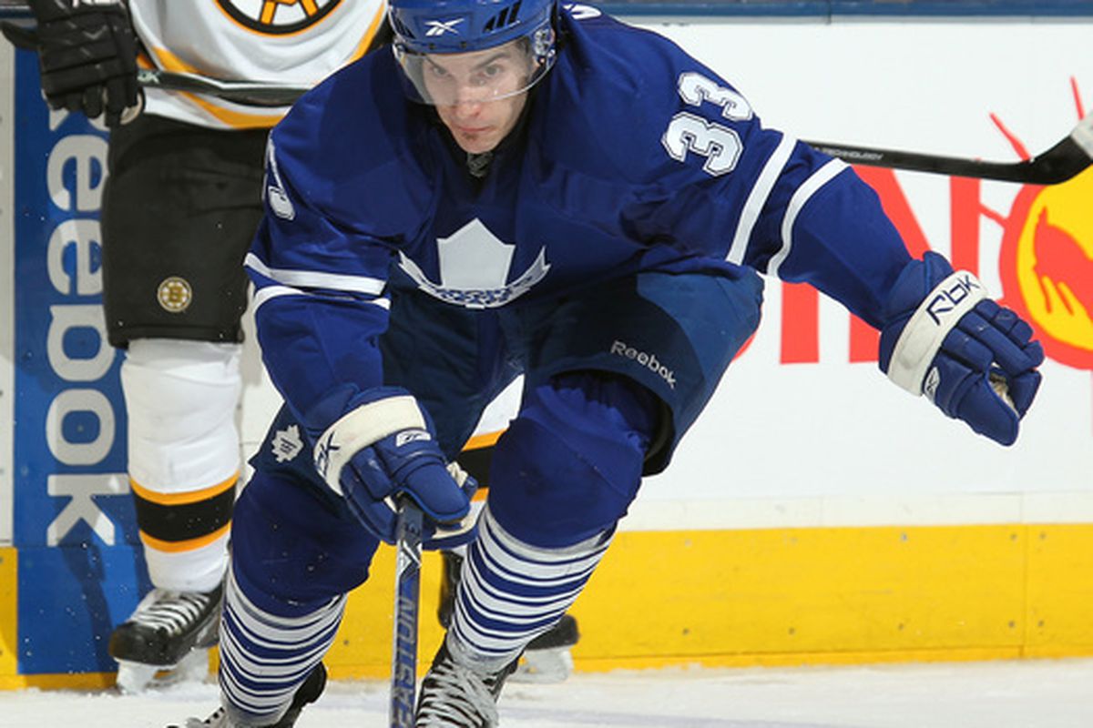 TORONTO, ON - APRIL 3: Luca Caputi #33 of the Toronto Maple Leafs goes after a loose puck in a game against the Boston Bruins on April 3, 2010 at the Air Canada Centre in Toronto, Ontario. (Photo by Claus Andersen/Getty Images)