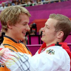 Epke Zonderland of Netherlands and silver medalist Fabian Hambuchen of Germany celebrate after the Artistic Gymnastics Men’s Horizontal Bar final. (Photo by Ronald Martinez/Getty Images)