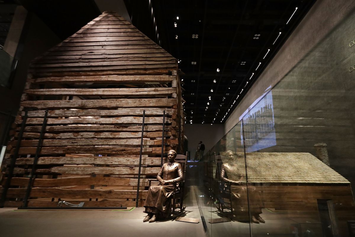 A statue of Colorado pioneer and former slave Clara Brown is on display next to a preserved slave cabin at the Smithsonian’s National Museum of African American History and Culture in Washington, DC. Filled with exhibits and artifacts telling the story of