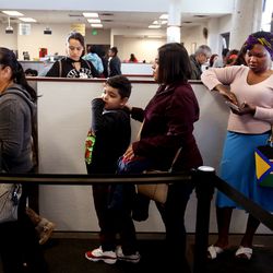People wait in line at the driver license division in West Valley City on Wednesday, Jan. 30, 2019.