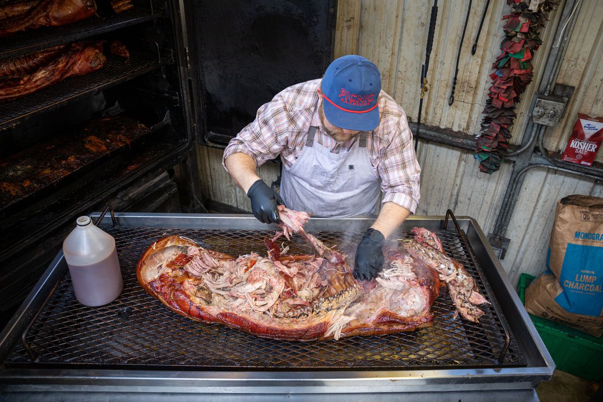 Wyatt Dickson cooking a whole hog at Picnic in Durham