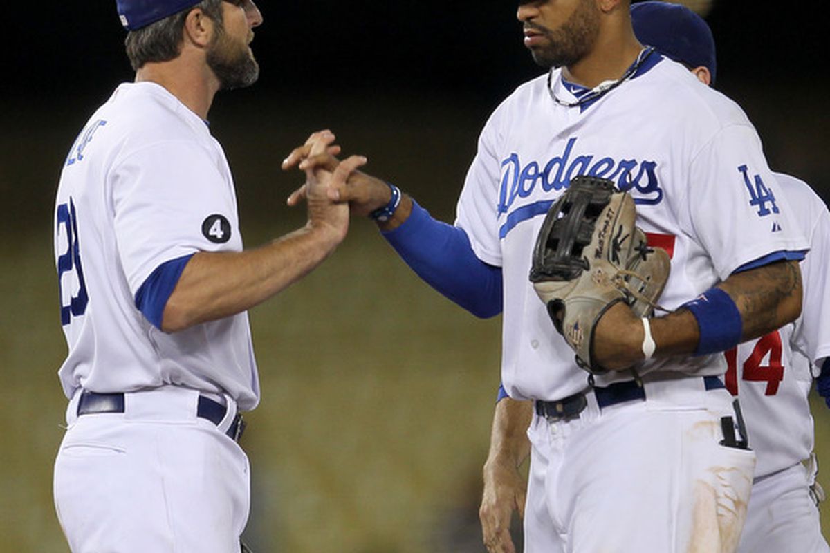 The only two Dodgers with an OPS above .768 in May show off the elaborate handshake to their secret club.