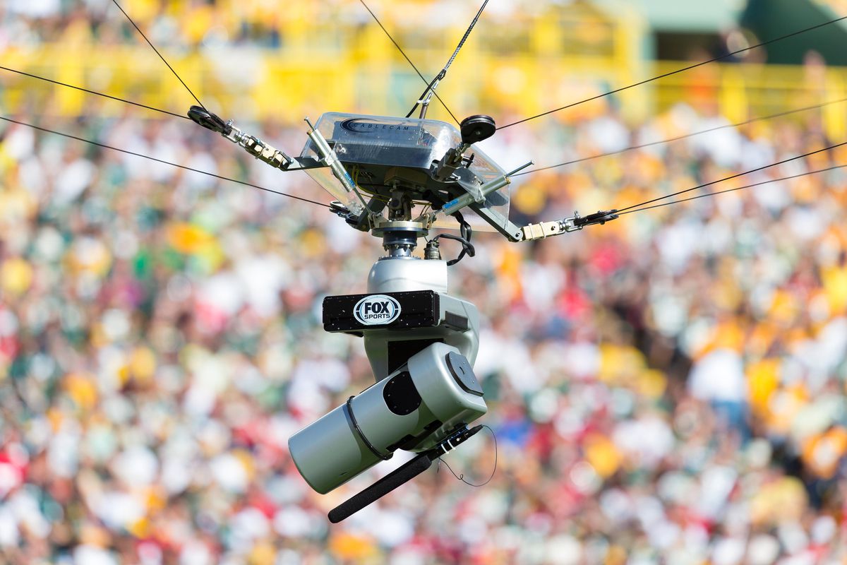 Sep 9, 2012; Green Bay, WI, USA;  A Fox tv camera hangs over the field during the game between the San Francisco 49ers and Green Bay Packers at Lambeau Field.  The 49ers defeated the Packers 30-22.  Mandatory Credit: Jeff Hanisch-US PRESSWIRE