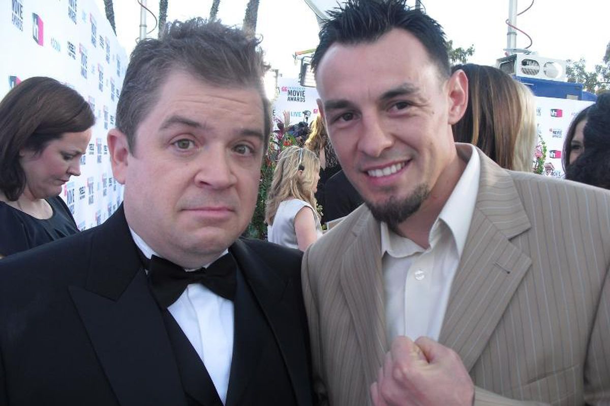 Robert Guerrero stands by a surprised-looking Patton Oswalt at the Critics Choice Awards. (Photo by Mario Serrano)