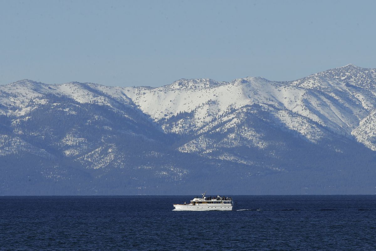 Snow covers the mountain tops along Lake Tahoe.