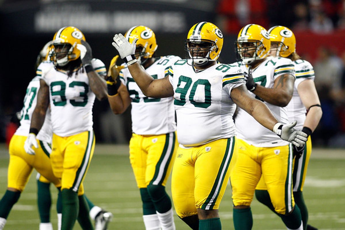 B.J. Raji #90 of  the Green Bay Packers celebrates a defensive play against the Atlanta Falcons during their 2011 NFC divisional playoff game at Georgia Dome on January 15 2011 in Atlanta Georgia.  (Photo by Chris Graythen/Getty Images)