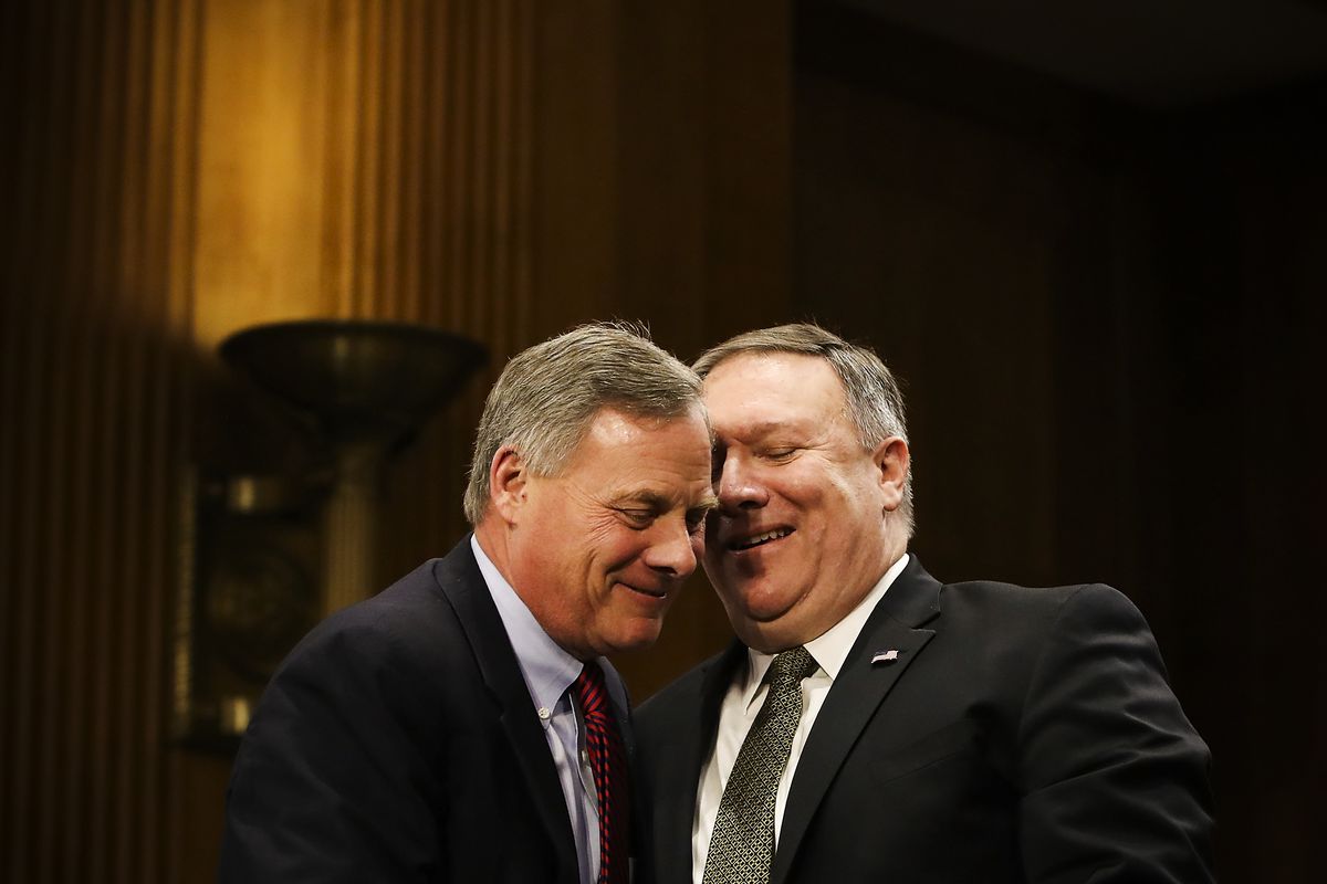 Secretary of State nominee Mike Pompeo (right), thanks Sen. Richard Burr (R-NC), for his comments during his confirmation hearing before a Senate Foreign Relations Committee on Capitol Hill, on April 12, 2018.