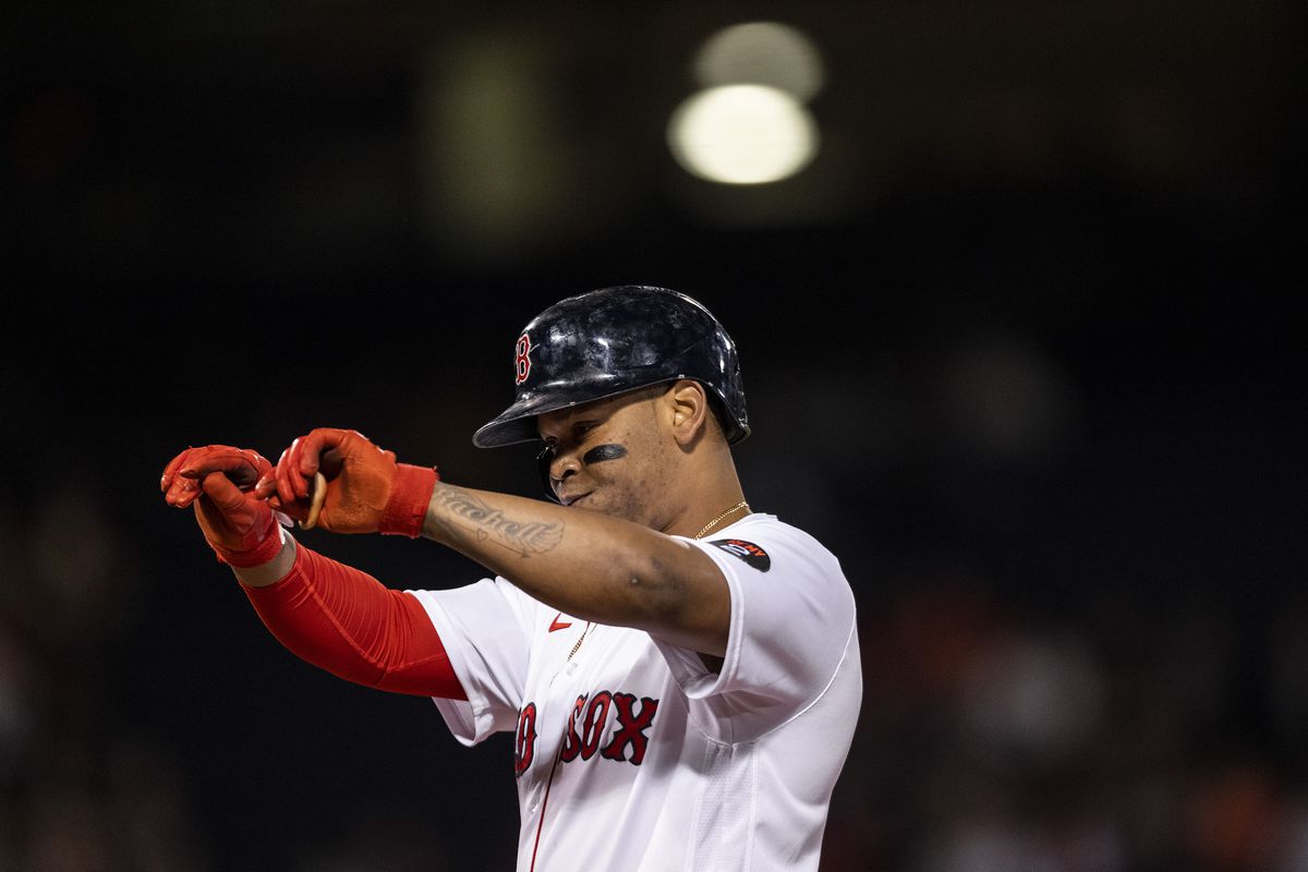 Rafael Devers of the Boston Red Sox reacts after hitting a single during the first inning of a game against the Baltimore Orioles on September 27, 2022 at Fenway Park in Boston, Massachusetts.