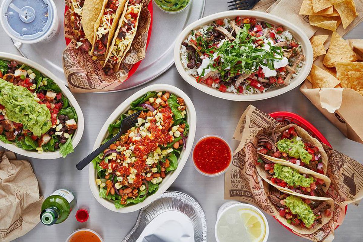 Spread of Chipotle food offerings on a table