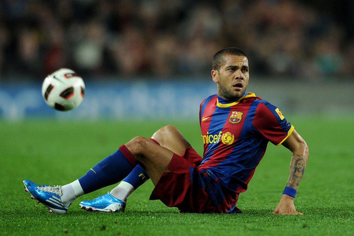 BARCELONA SPAIN - FEBRUARY 20:  Daniel Alves of Barcelona sits on the pitch during the la Liga match between Barcelona and Athletic Bilbao at Camp Nou stadium on February 20 2011 in Barcelona Spain.  (Photo by Jasper Juinen/Getty Images)