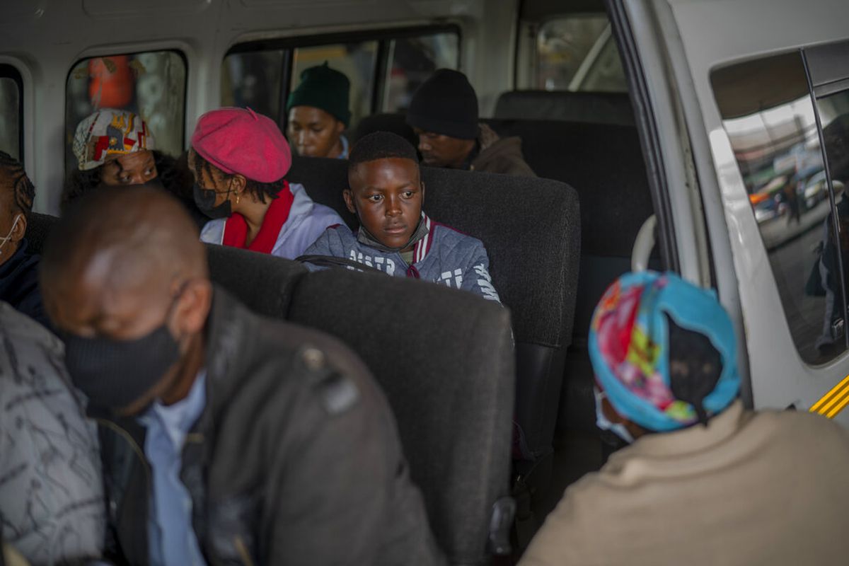 Passengers, some wearing masks, in Soweto, South Africa.