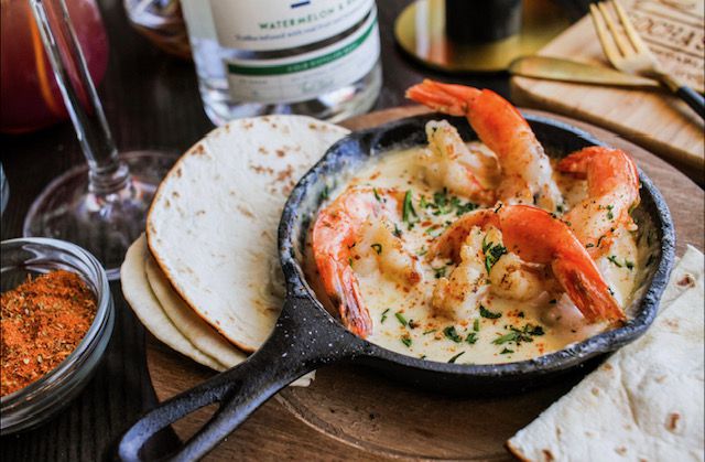 Shrimp scampi served in a personalized cast iron skillet from Gocha’s Tapas Bar in South Fulton, GA