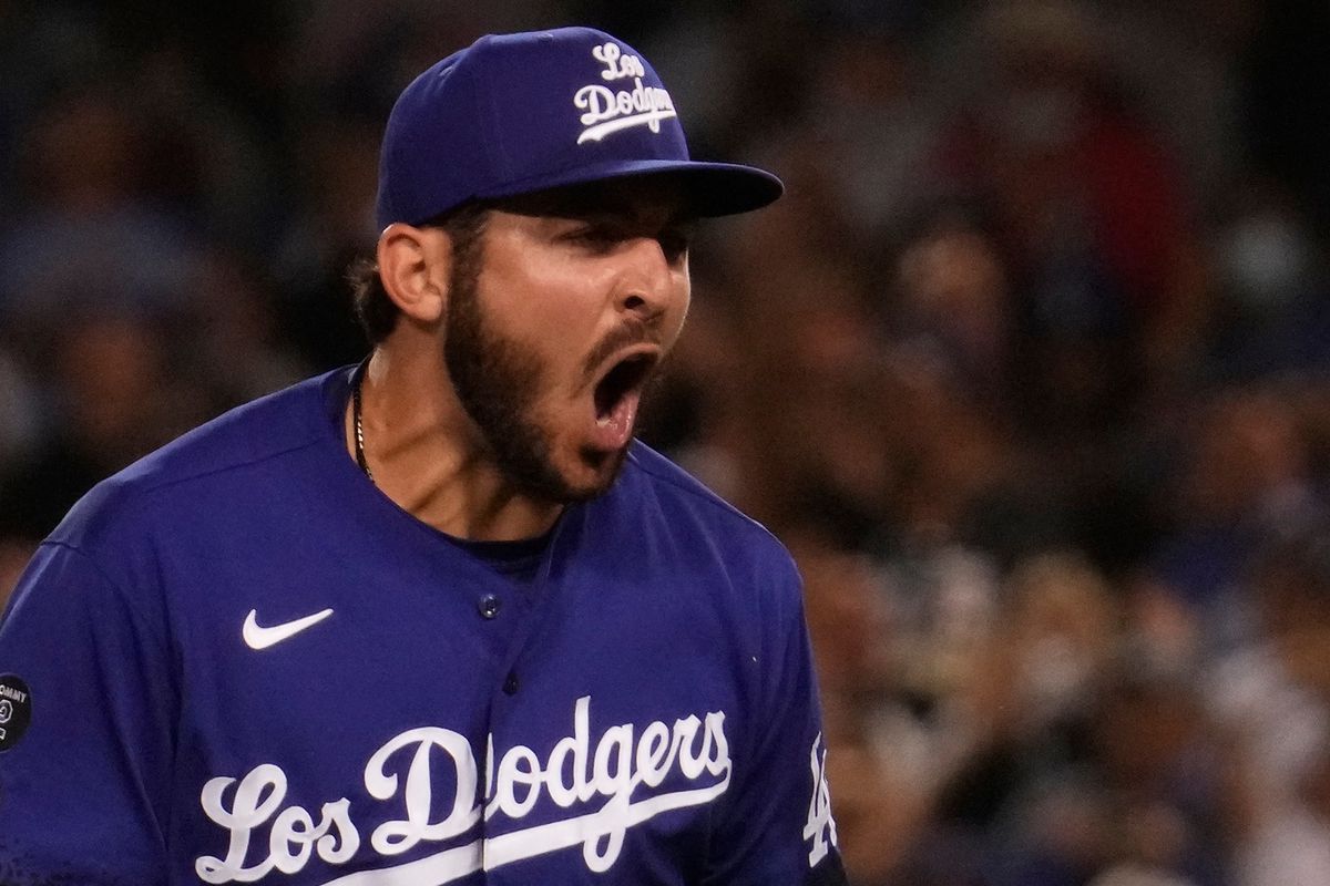 Los Angeles Dodgers relief pitcher Alex Vesia (51) reacts after striking out New York Mets left fielder J.D. Davis (28) to end the eight inning at Dodger Stadium