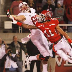 Utah's Davion Orphey defends Stanford's Charlie Hopkins on a third down attempt late in the fourth quarter of play as Utah and Stanford play Saturday, Oct. 12, 2013 at Rice Eccles Stadium in Salt Lake City. Utah won 27-21.