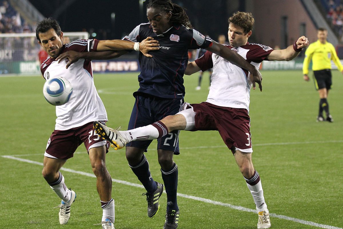 FOXBORO, MA - MAY 7:  Pablo Mastroeni #25 and Drew Moor of Colorado Rapids battles Shalrie Joseph #21of New England Revolution at Gillette Stadium on May 7, 2011 in Foxboro, Massachusetts. (Photo by Jim Rogash/Getty Images)