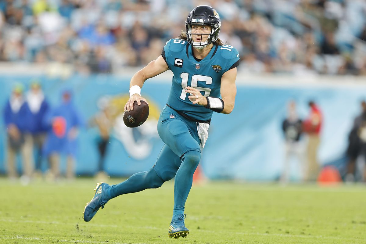 Trevor Lawrence #16 of the Jacksonville Jaguars scrambles with the ball during the second half against the Houston Texans at TIAA Bank Field on December 19, 2021 in Jacksonville, Florida.