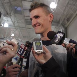 Utah Jazz forward Andrie Kirilenko (left) smiles while talking to the media during Jazz practice at the Zions Bank Basketball Center.  Feb. 16, 2009. Michael Brandy, Deseret News