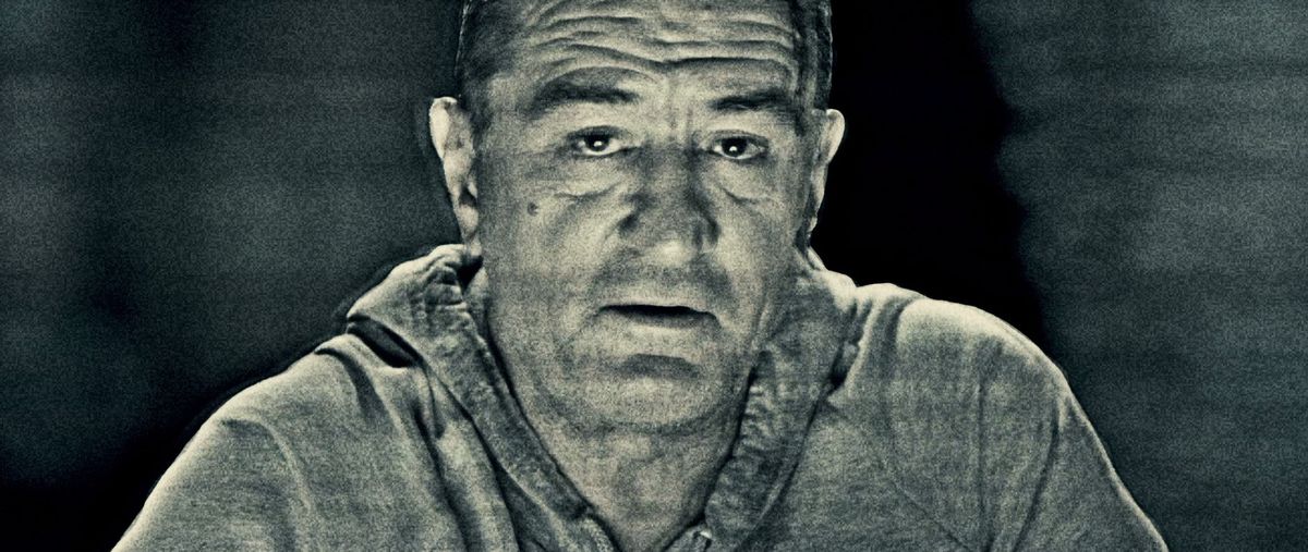 robert de niro in righteous kill looks into camera via a scratchy video feed