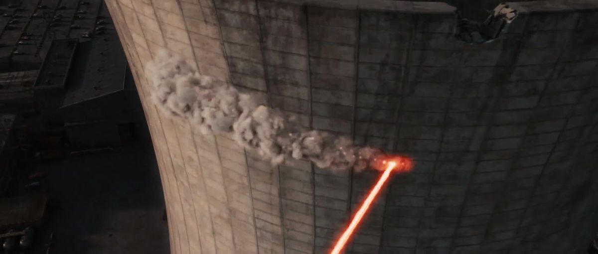 Deadpool’s still-firing lasers plow a line of destruction through the cement of the nuclear power station smokestack in X-Men Origins: Wolverine.