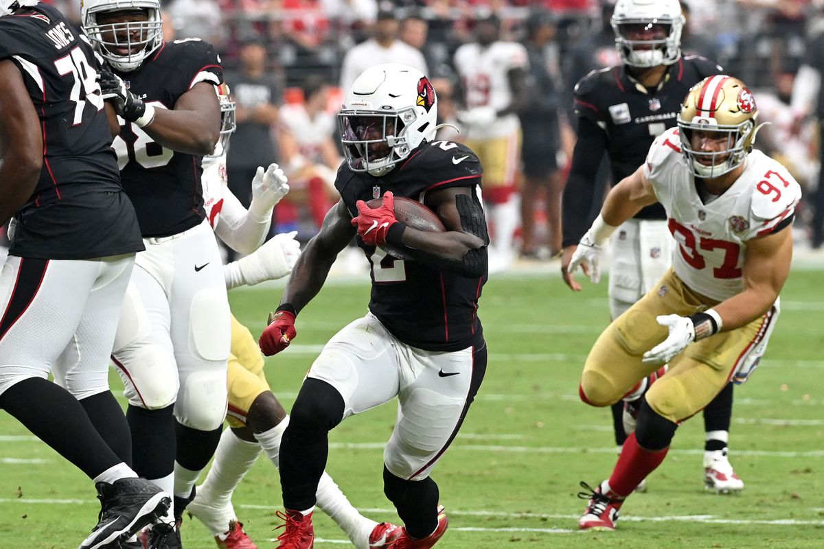 Chase Edmonds #2 of the Arizona Cardinals runs with the ball against the San Francisco 49ers during the second quarter at State Farm Stadium on October 10, 2021 in Glendale, Arizona.