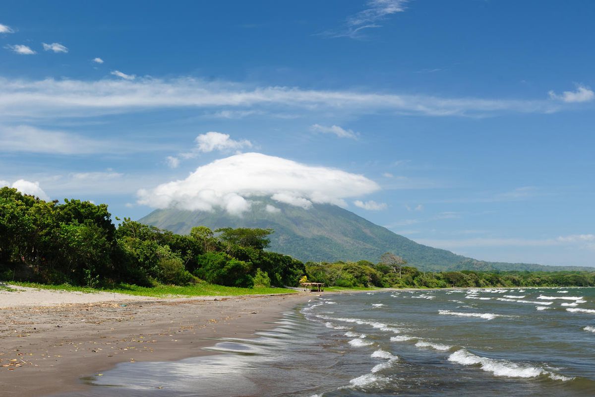 Central America, Nicaragua, landscapes on an Ometepe island. The picture present the sand Santo Domingo beach with the view on the volcano Concepcion