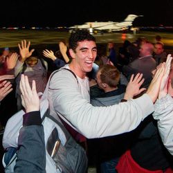 BYU's Corbin Kaufusi and the BYU men's basketball team were greeted by fans and members of the ROC student section at the Provo Airport after their upset win at No. 3 Gonzaga.
