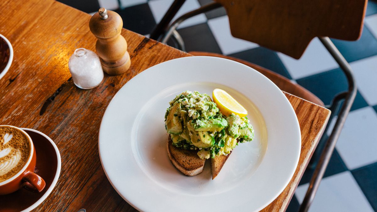 An avocado toast sits on a table at Batch in Melbourne