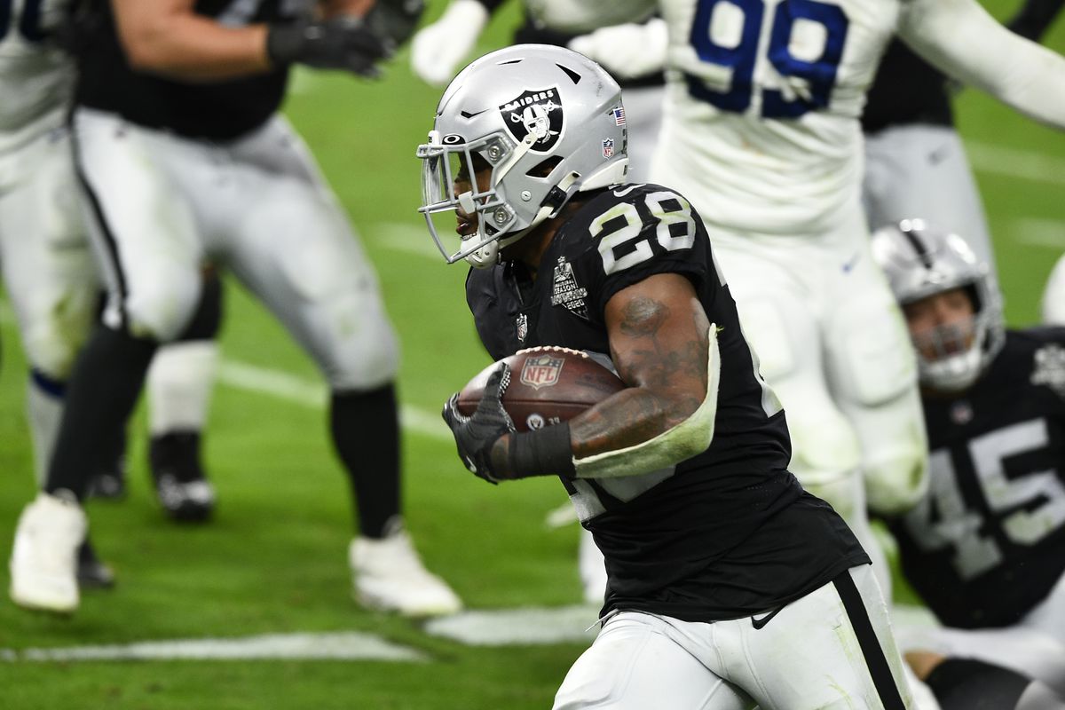 Running back Josh Jacobs #28 of the Las Vegas Raiders runs against the Indianapolis Colts in the second half of their game at Allegiant Stadium on December 13, 2020 in Las Vegas, Nevada.