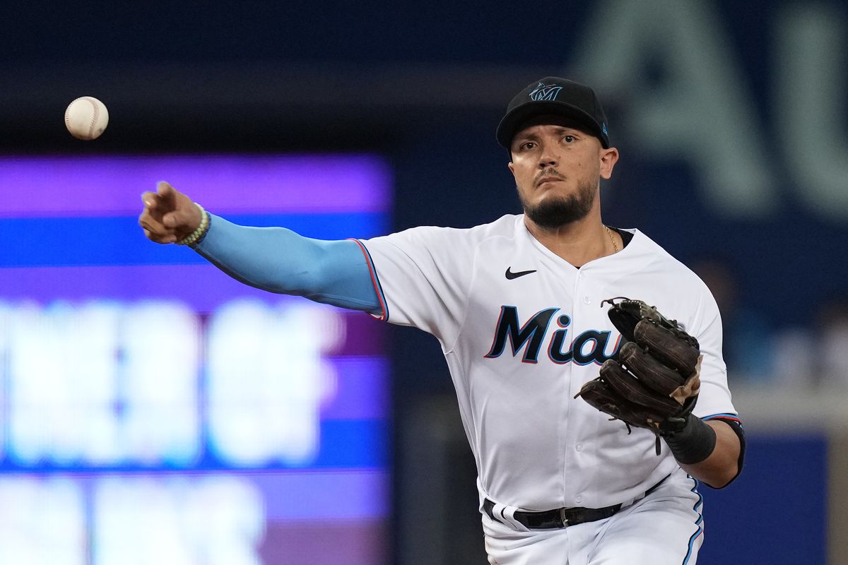 Miami Marlins shortstop Miguel Rojas (19) throws out New York Mets second baseman Javier Baez (not pictured) in the 1st inning at loanDepot park