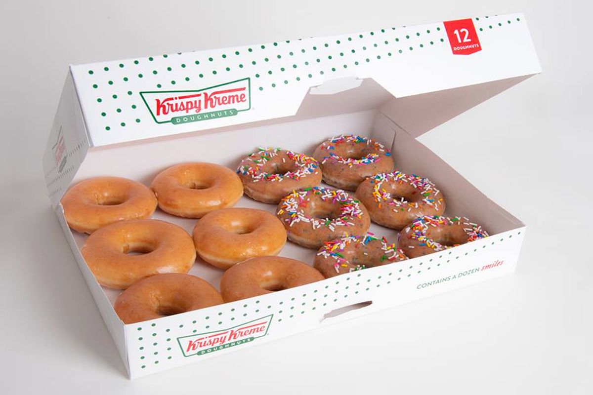A box of a dozen glazed and sprinkle doughnuts