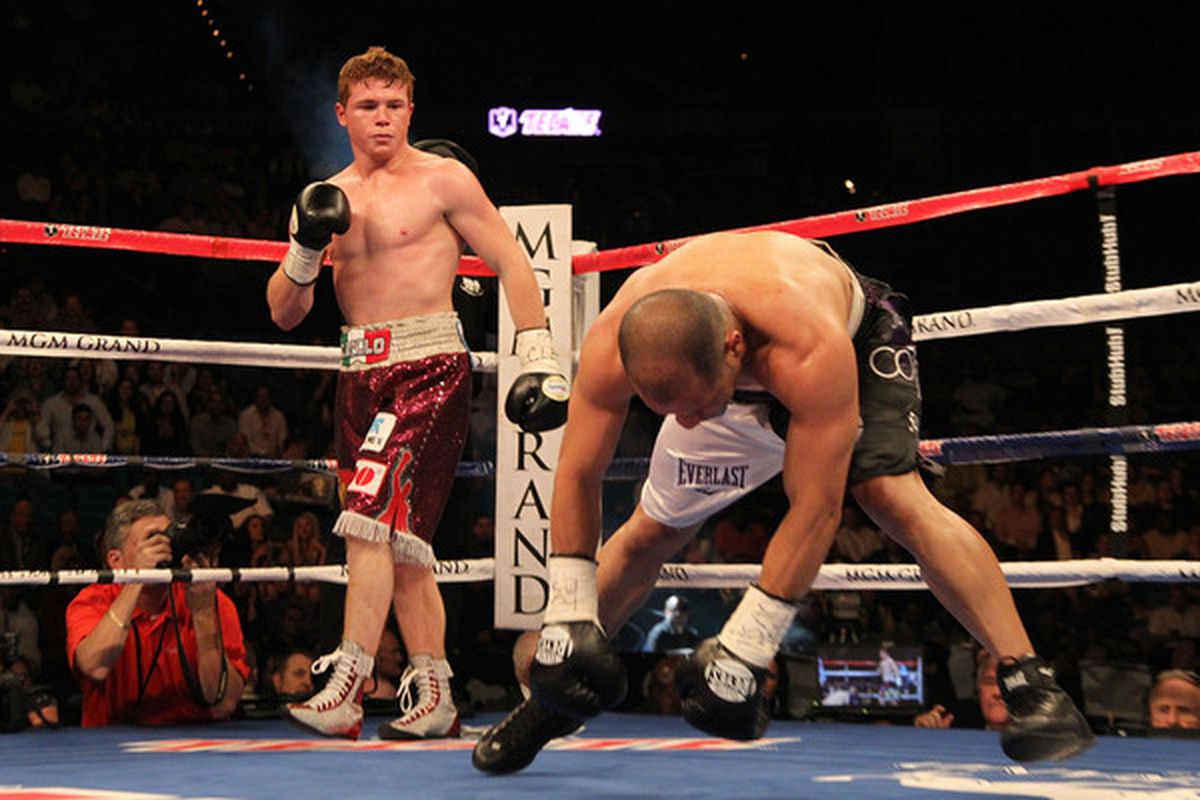 LAS VEGAS - MAY 01:  (L-R) Saul Alvarez of Mexico knocks down Jose Miguel Cotto of Puerto Rico during the welterweight fight at the MGM Grand Garden Arena on May 1, 2010 in Las Vegas, Nevada.  (Photo by Jed Jacobsohn/Getty Images)