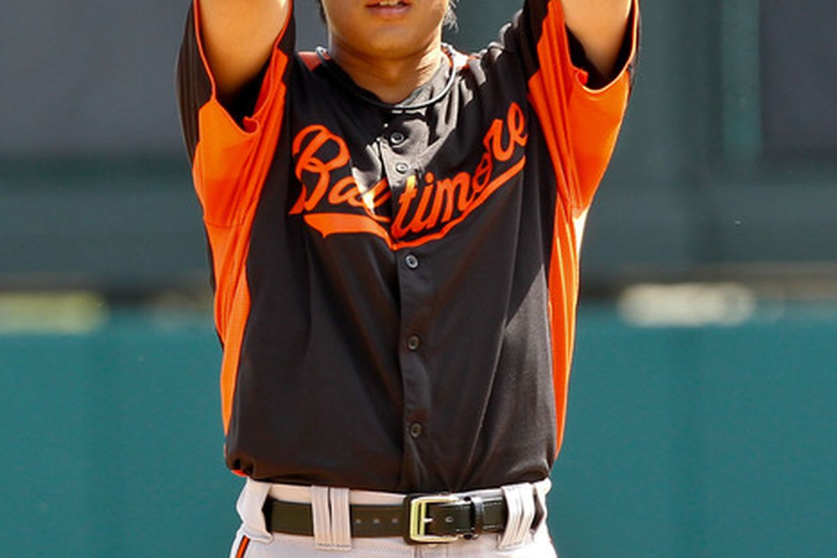 March 18, 2012; Lake Buena Vista, FL, USA; Baltimore Orioles starting pitcher Tsuyoshi Wada (18) against the Atlanta Braves during a spring training game at Disney Wide World of Sports complex. Mandatory Credit: Derick E. Hingle-US PRESSWIRE