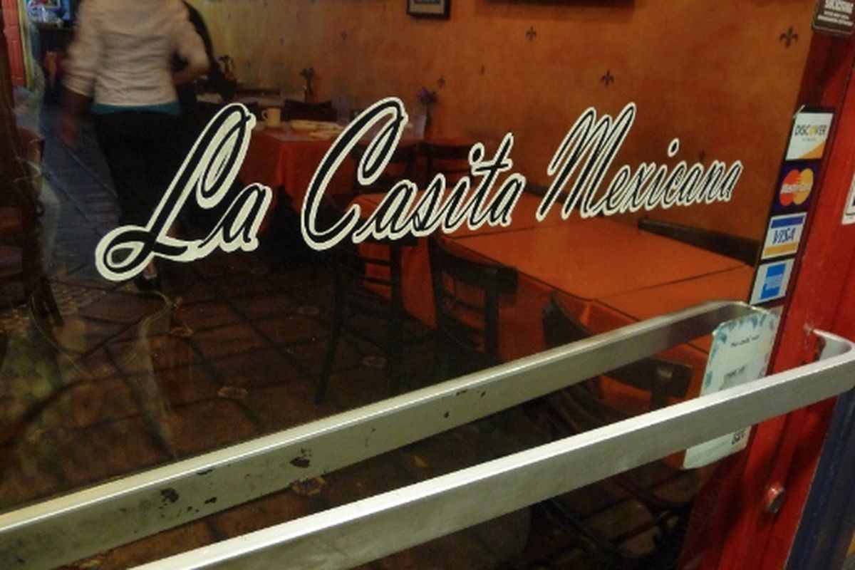 Door signage at La Casita Mexicana, Bell. 