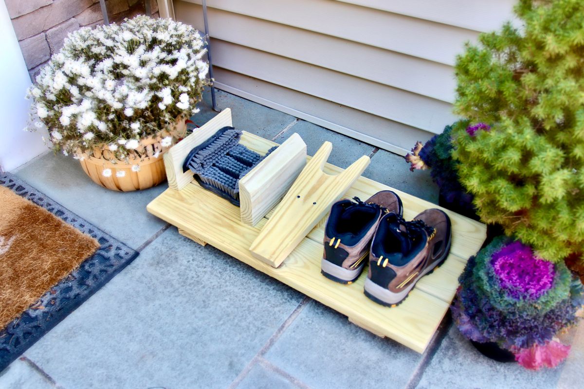A simple boot cleaner made from tools and lumber.