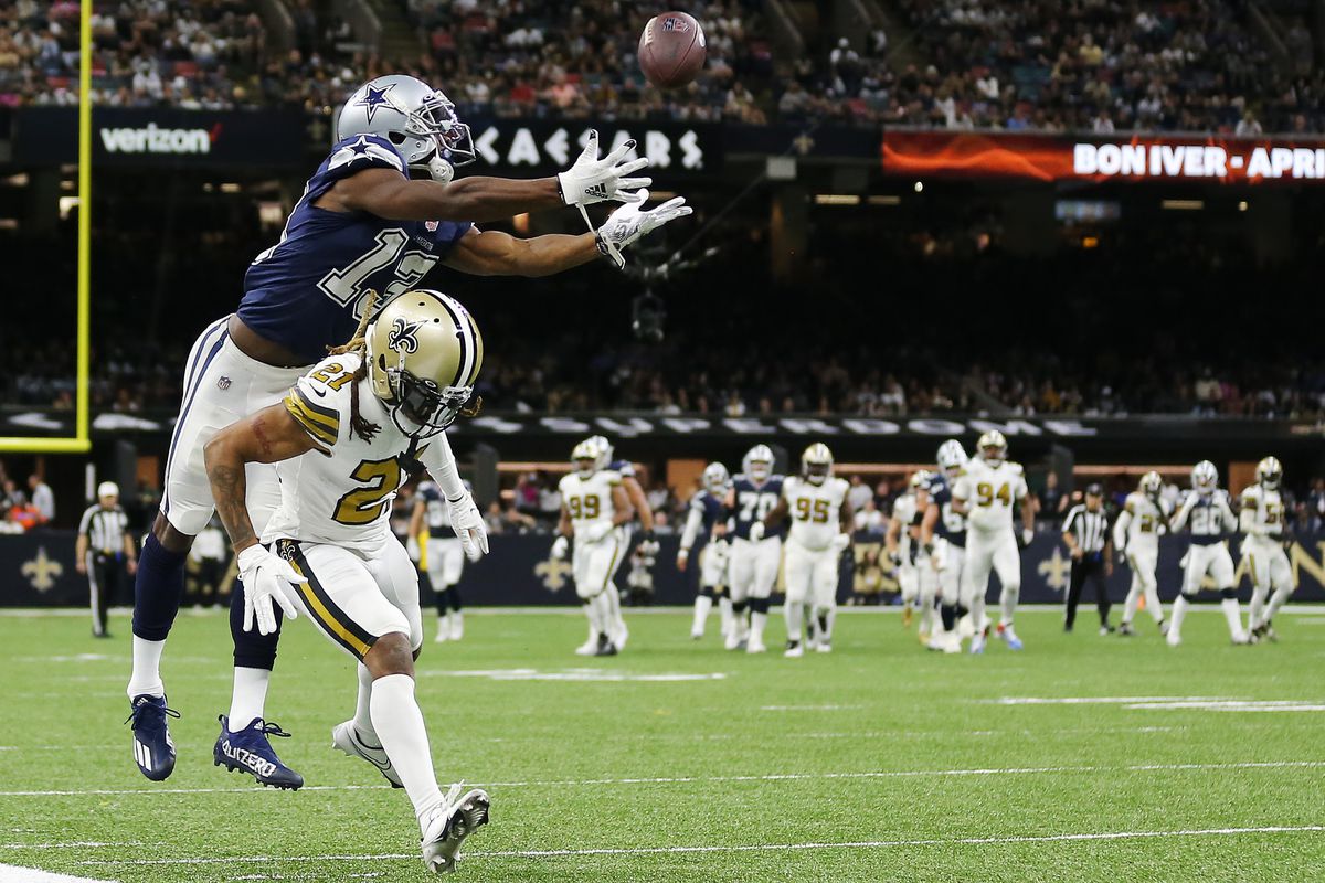 Michael Gallup #13 of the Dallas Cowboys attempts to catch the ball as Bradley Roby #21 of the New Orleans Saintsdefends in the third quarter of the game at Caesars Superdome on December 02, 2021 in New Orleans, Louisiana.