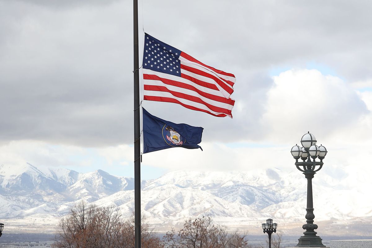 An American flag and Utah state flag fly at half-staff at the Capitol in Salt Lake City on Tuesday, Feb. 23, 2021. Gov. Spencer Cox has ordered the U.S. flag and the state flag be flown at half-staff through Friday in memory of the 500,000 American lives lost to COVID-19.
