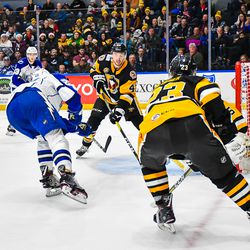 Syracuse Crunch Ross Colton (22) shoots and scores against the Wilkes-Barre/Scanton Penguins in American Hockey League (AHL) action at the War Memorial Arena in Syracuse, New York on Saturday, December 22, 2018. Syracuse won 4-3 in OT.