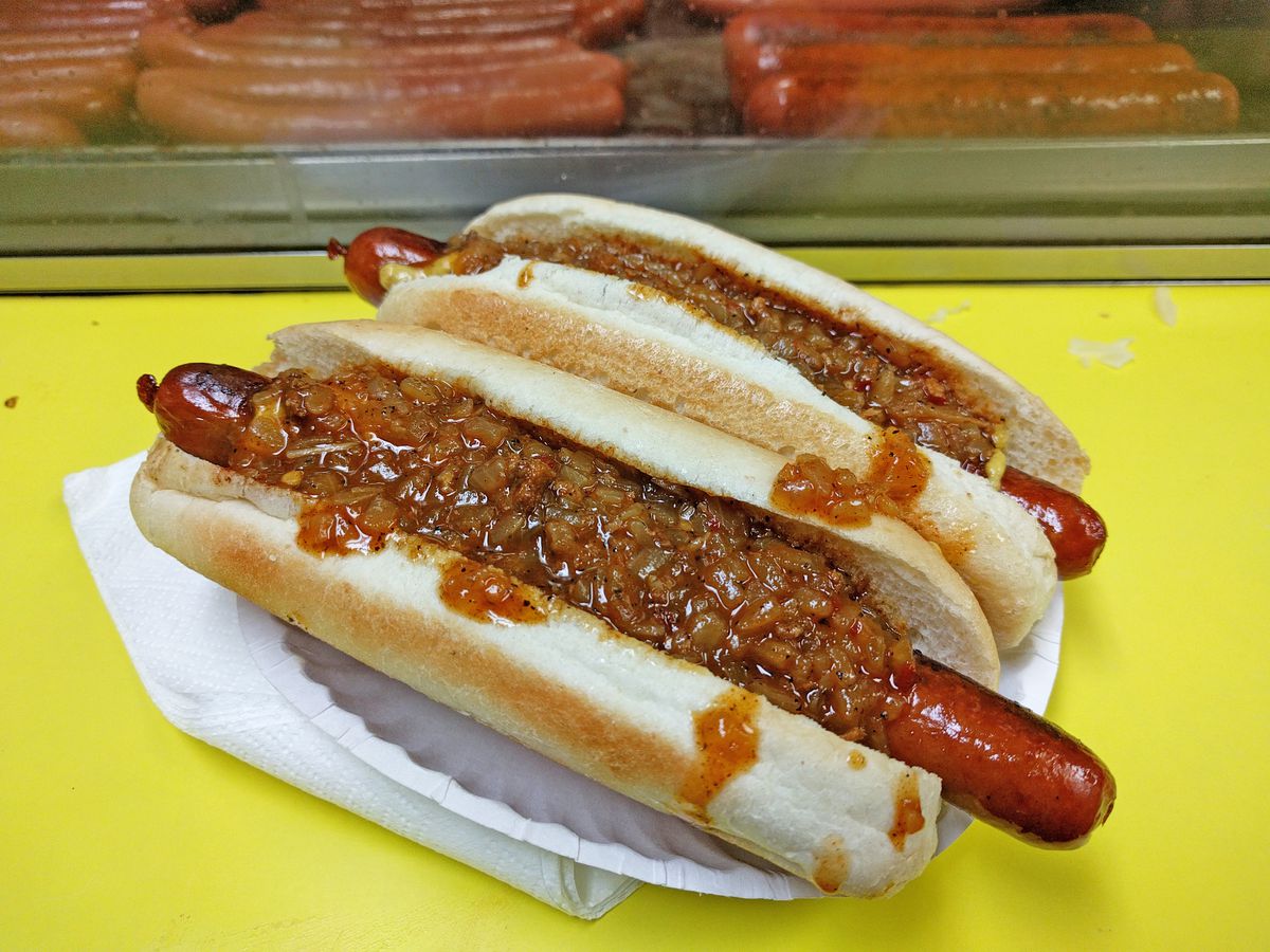 Boulevard Drinks’ all beef franks, with chili on a yellow background