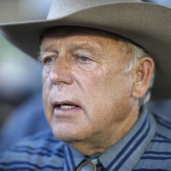 FILE - This April 11, 2015 file photo shows rancher Cliven Bundy as he speaks with supporters at an event in Bunkerville, Nev. Federal prosecutors in Las Vegas are asking a judge to cancel a hearing at which Bundy, currently jailed, would seek to be freed pending trial on charges that he led an armed standoff against government agents two years ago. Bundy's lawyer, Joel Hansen, said Wednesday, March 16, 2016 he's fighting U.S. Attorney Daniel Bogden's request to call off the Thursday detention hearing.