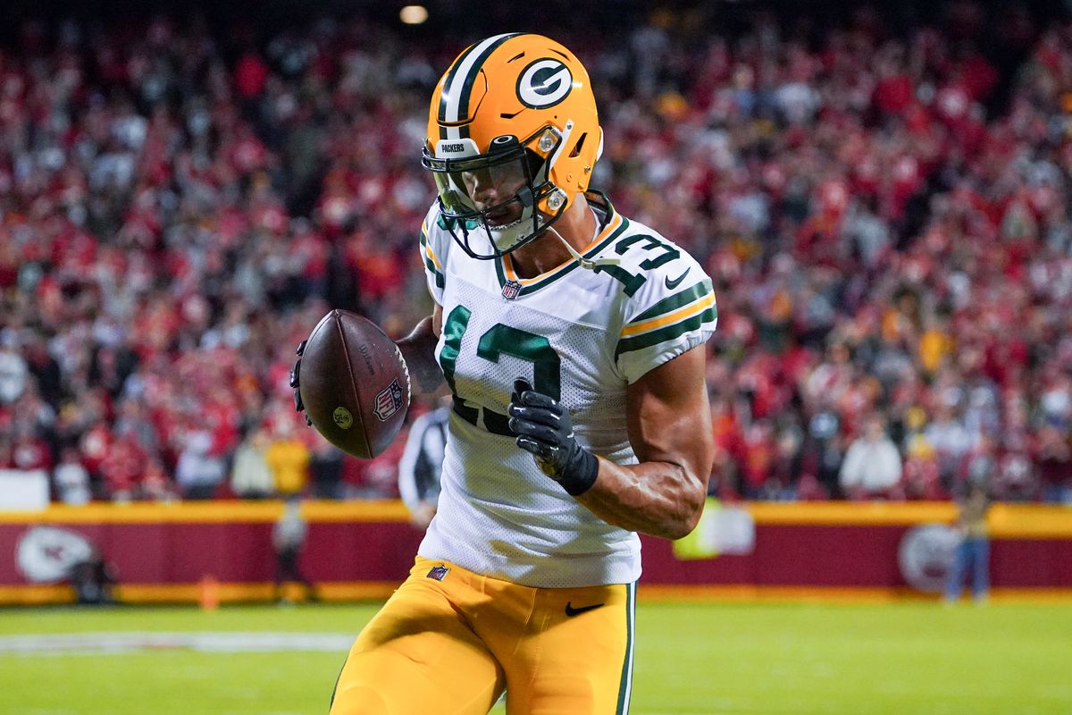 Green Bay Packers wide receiver Allen Lazard (13) scores a touchdown against the Kansas City Chiefs during the second half at GEHA Field at Arrowhead Stadium.